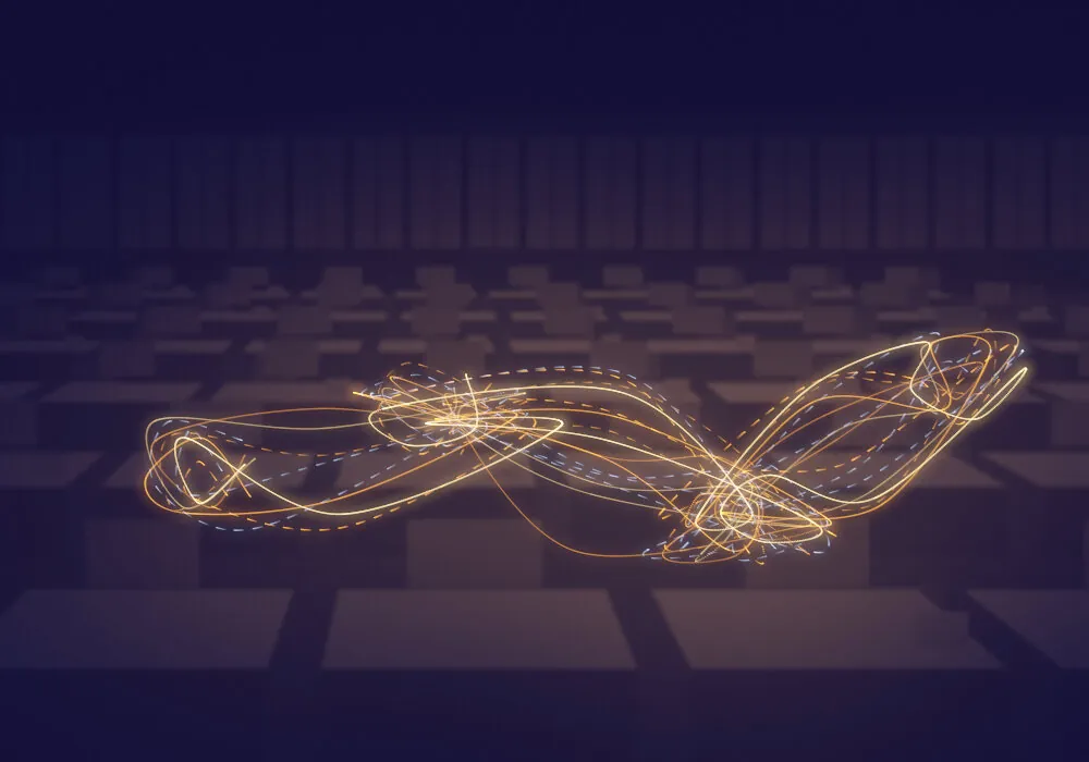 Trails of light moving across desks in an office at night